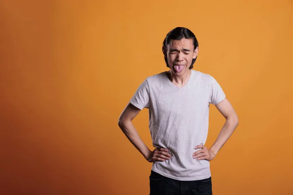 Young Asian Man Being Silly Showing Tongue Making Funny Grimace — 图库照片