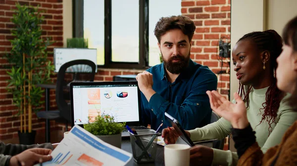 Project Manager Showing Business Charts Laptop Coworkers Talking Collaboration Data — ストック写真