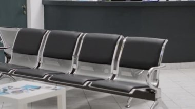 Waiting room lobby with empty reception counter desk to give help and support to patients with consultation appointments. Professional treatment space with checkup visits and clinical exam.