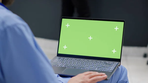 Male Nurse Holding Laptop Greenscreen Template Waiting Room Working Medical — Stock fotografie