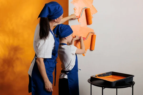 Small Family Painting Walls Orange Color Paint Roller Brush Doing — Stockfoto
