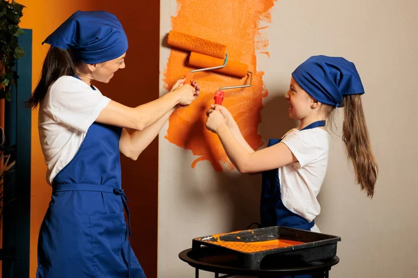 Woman Kid Painting House Walls Orange Color Paint Using Renovating — Stockfoto