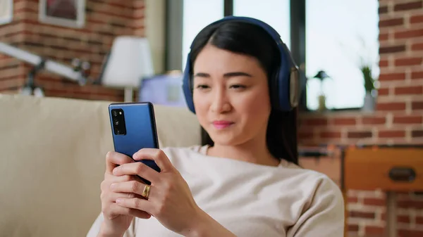 Joyful Person Sending Messages Smartphone While Listening Music Wireless Headphones — Fotografia de Stock