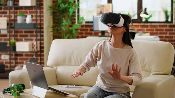 Playful Woman Wearing Virtual Reality Headset Scrolling Metaverse Cyberspace While — 图库照片