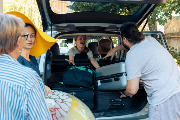 Excited Family Travelling Vacation Car Putting Trolley Bags Trunk Vehicle — Stok fotoğraf