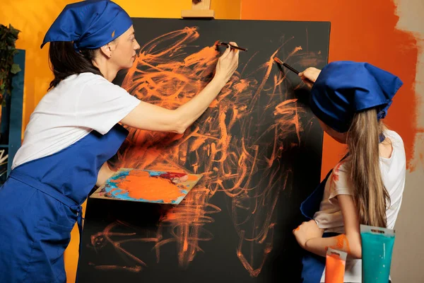 Mother Small Kid Creating Masterpiece Orange Color Aquarelle Paint Dye — 스톡 사진