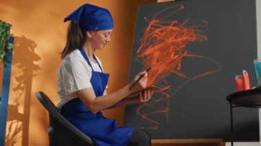 Creative artist painting art design with brush and aquarelle color, using watercolor palette and paintbrush on canvas. Creating artwork with artistic tools and inspiration, leisure activity.