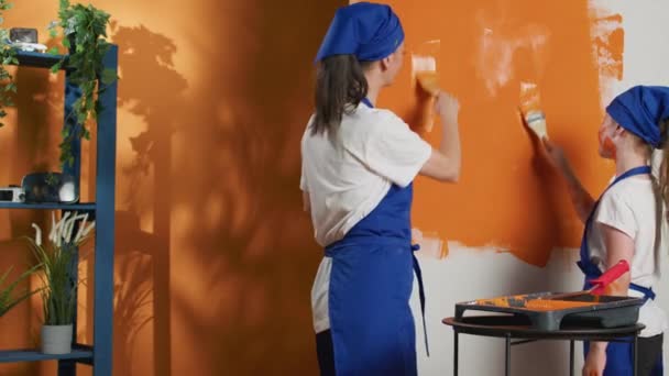 Mother Kid Using Orange Paint Change Walls Color Housework Renovation — Stock video