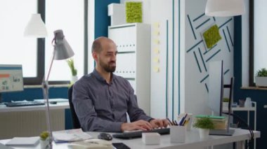 Business man with financial expertise planning sales charts to do development research in startup office. Male consultant working on computer to analyze online e commerce statistics.