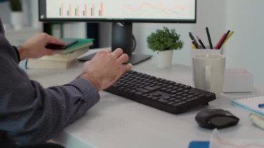Marketing consultant with financial expertise using smartphone, browsing internet to plan strategy. Sales analyst working on mobile phone to create business development. Close up.