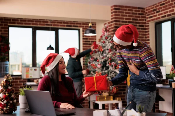 African American Employee Giving Present Colleague Celebrating Holiday Season Christmas —  Fotos de Stock