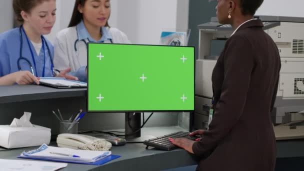 Diverse Medical Staff Working Greenscreen Computer Hospital Reception Counter Using — Stock videók