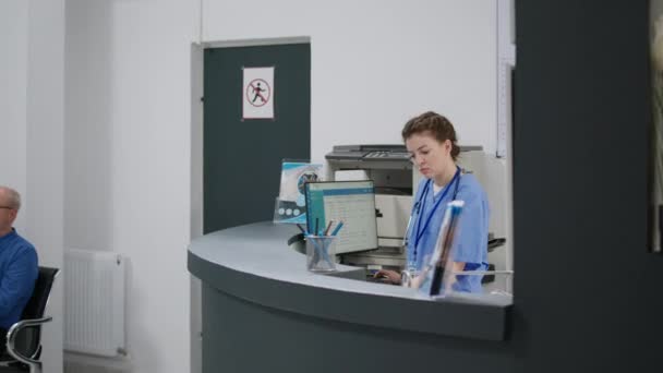 Multiethnic Team Helping Medical Appointments Hospital Reception Desk Facility Lobby — Stock videók