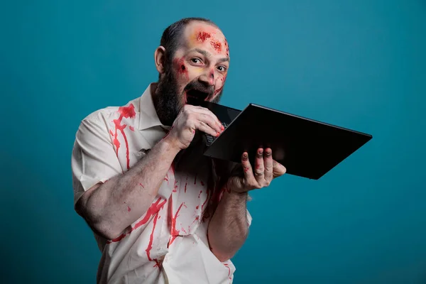Scary Zombie Biting Laptop Computer Having Bloody Scars Wounds Creepy — Fotografia de Stock