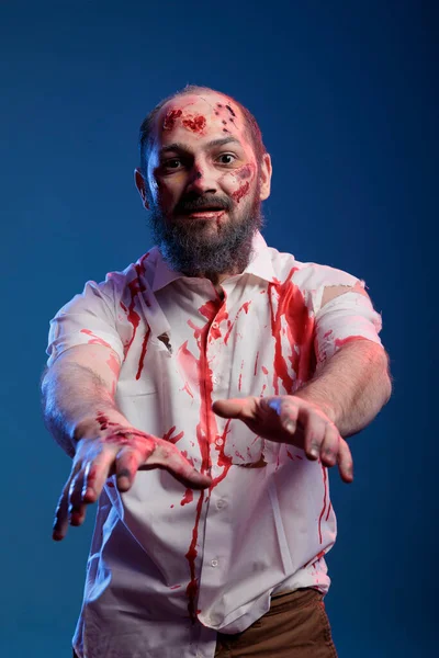 Evil Halloween Zombie Attacking Studio Camera Having Ugly Bloody Scars — Stockfoto