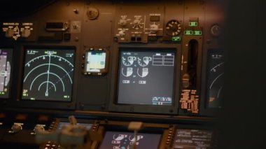 Airplane cockpit with flying command on control panel and dashboard for navigation, engine throttle and radar compass. Plane cabin with windscreen, buttons and handle. Close up.