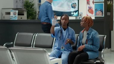 Augmente reality VFX futuristic medical consultation in hospital lobby. Nurse with patient looking at medicine diagnosis in IOT doctor interface, future technology. AR 3D render animation