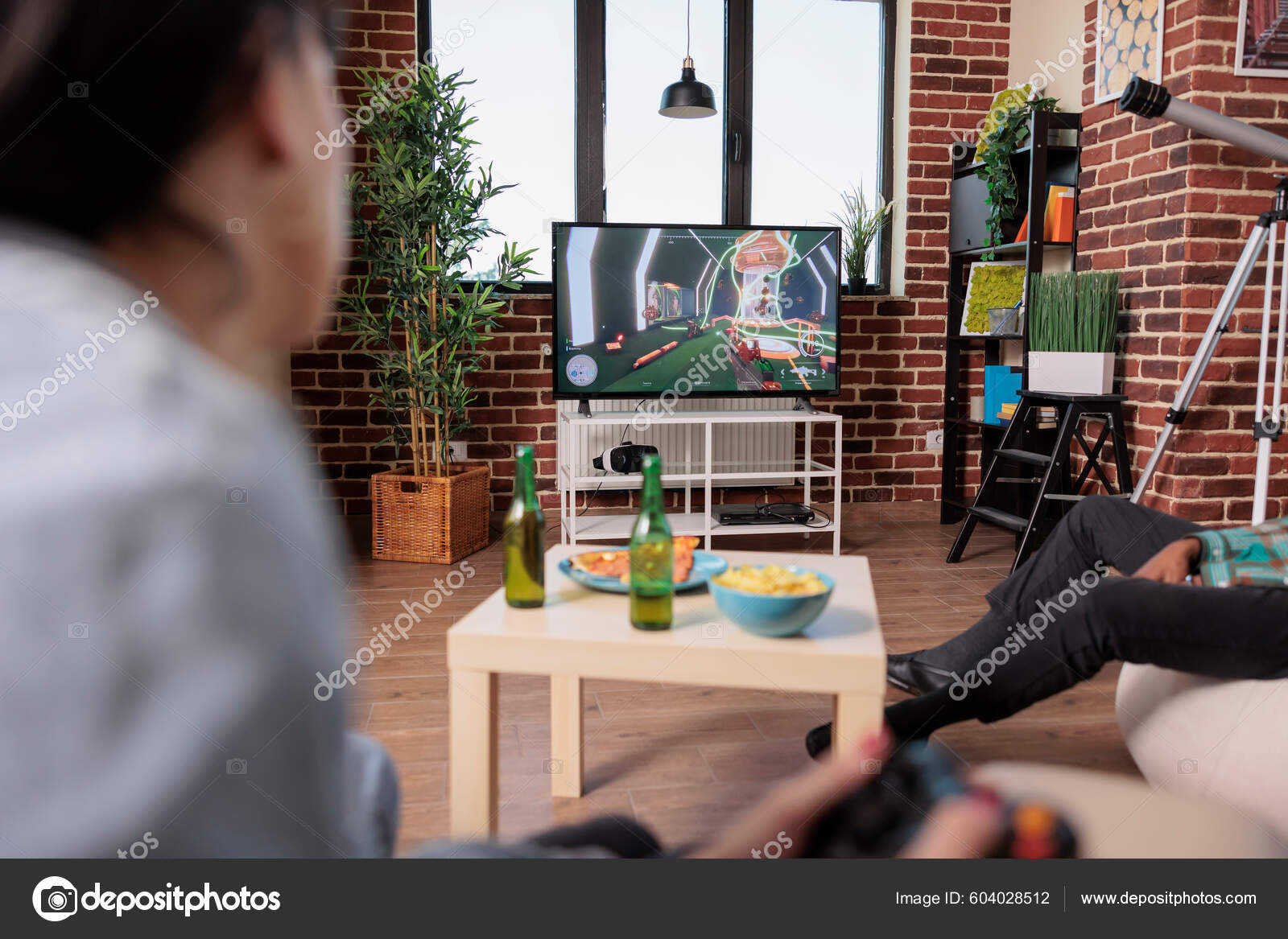 Young Adult Playing Shooting Video Games Strategy Home Having Fun Stock Photo by ©DragosCondreaW 604028512