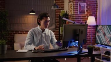 Male freelancer using credit or debit card to do online shopping, making purchase order in retail store website. Doing money payment on discount sale to buy, electronic transation. Handheld shot.