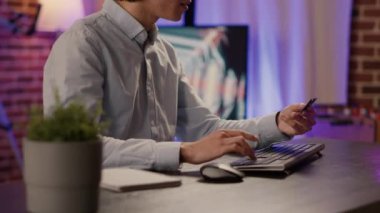 Company worker doing online shopping with credit card on computer, making discount purchase with banking transaction. Buying from retail store website to order on sale, electronic currency.