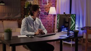 Telework employee attending online videoconference meeting to talk to business people on computer webcam. Chatting on remote videocall conference, virtual network conversation. Handheld shot.