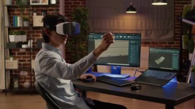 Creative engineer working with vr glasses and designing industrial product, using manufactory software to develop engine component. Augmented reality to create machinery. Handheld shot.