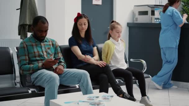 Portrait Young Mother Little Girl Sitting Hospital Reception Lobby Attend — Stock Video