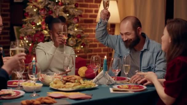 Cheerful Multiethnic Family Members Toasting Champagne While Enjoying Christmas Dinner — Stockvideo