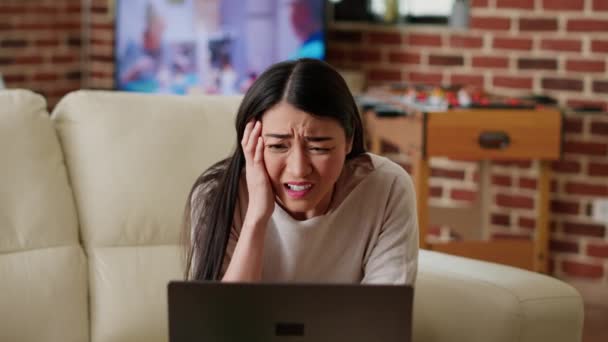 Worried Asian Person Looking Confused Computer Screen While Doing Remote — Vídeo de stock