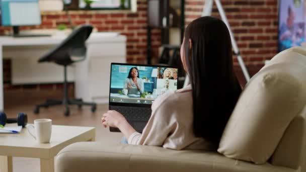 Young Woman Working Remotely Home While Attending Virtual Meeting Teleconference — стоковое видео