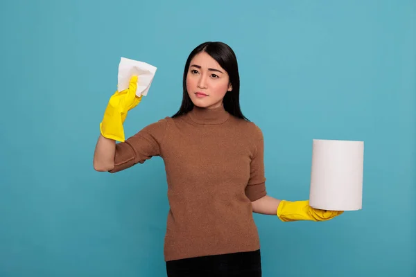 Confidence Young Woman Tissue Paper Holding Yellow Glove Standing Blue — Foto de Stock