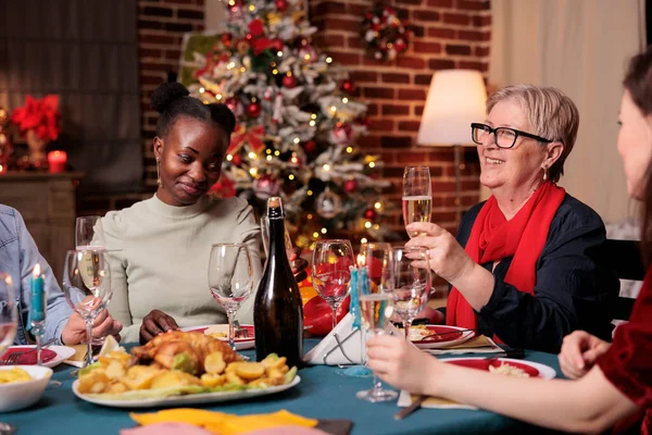 Family Drinking Sparkling Wine Middle Aged Woman Proposing Christmas Toast — Stok fotoğraf