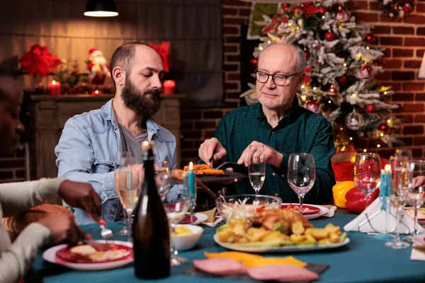 Diverse Family Having Christmas Festive Dinner Eating Traditional Food Decorated — Stockfoto
