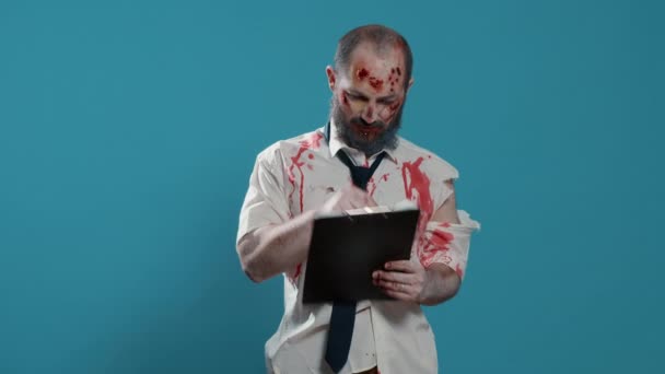 Heavy Wounded Scary Zombie Signing Delivery Documents Clipboard Creepy Mindless — Stock video