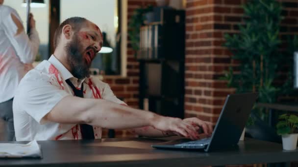 Creepy Looking Office Zombie Working Laptop While Smirking Bizarre Camera — Wideo stockowe