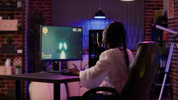 Man gamer teaching his girlfriend playing space shooter video game Stock  Photo by ©DragosCondreaW 465086788