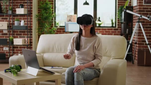 Woman Wearing Virtual Reality Headset Scrolling Metaverse Cyberspace While Sitting — 图库视频影像