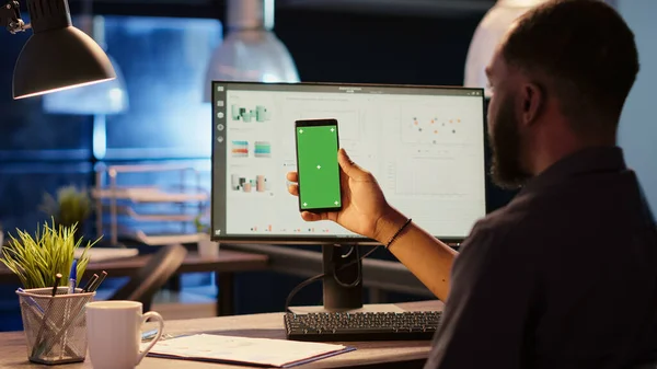 Project Manager Looking Greenscreen Template Smartphone Display Working Night Holding — Stockfoto