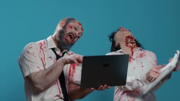 Dumb Creepy Looking Zombies Modern Laptop Device Clipboard Acting Childish — Vídeo de Stock