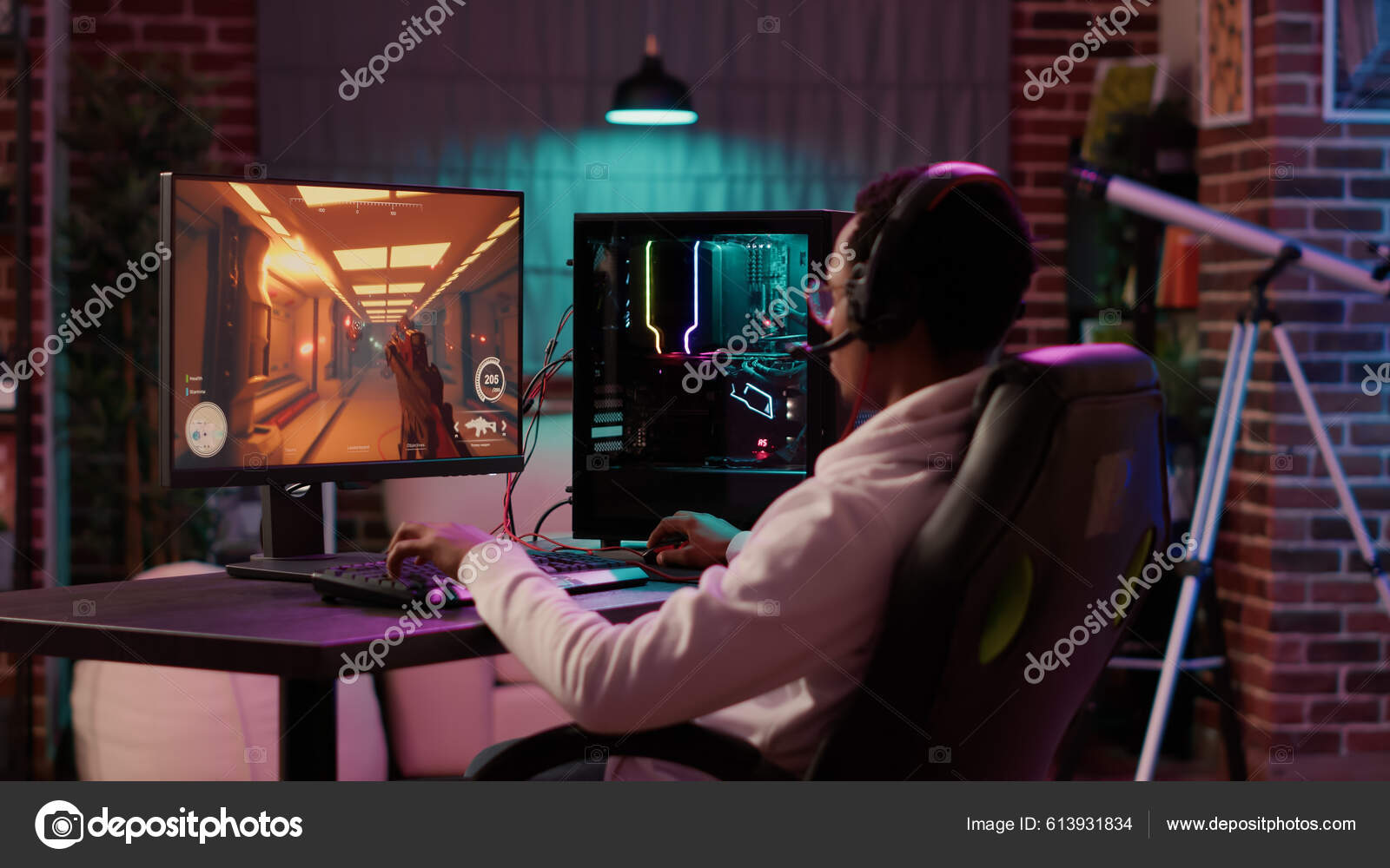 Free Photo  Person playing video games with controller on computer. player  using joystick and wearing headphones to play online game on monitor.  modern man using gaming equipment to have fun.