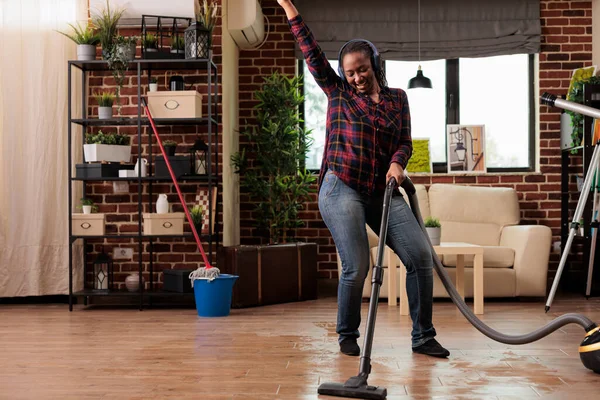 Authentic Woman Using Modern Vacuum Cleaner Listening Favorite Music Wireless — Stock Photo, Image