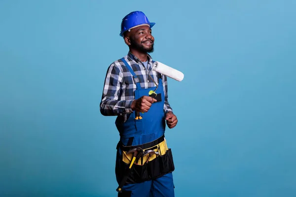 Happy Construction Worker Holding Paint Roller Performing Interior Renovation Optimism — Stock Photo, Image