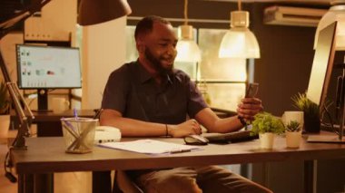 Company employee talking on remote videocall meeting, using online teleconference call on mobile phone with webcam. Chatting on internet videoconference with colleagues, telecommunications.