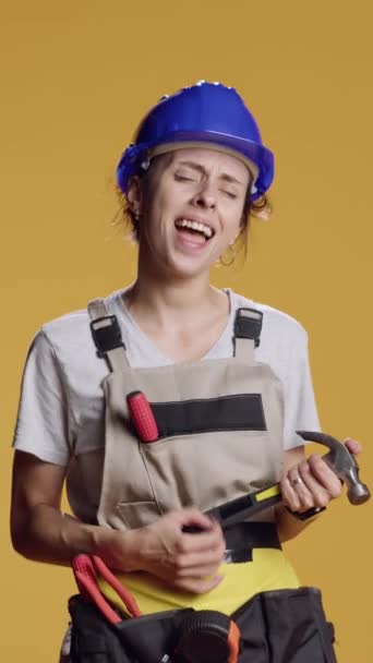 Vertical Video Portrait Silly Contractor Playing Air Guitar Hammer Doing — Stock Video
