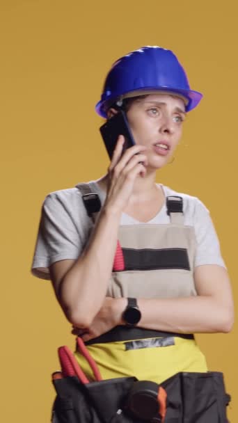 Vertical Video Portrait Empowered Handywoman Answering Phone Call Work Construction — Stock Video