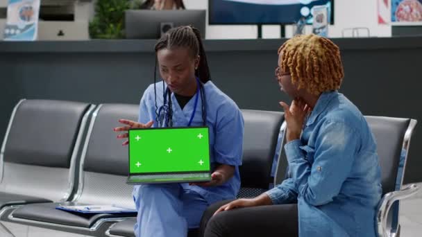 Nurse Patient Looking Laptop Greenscreen Display Consulting Waiting Room Reception — Stok Video