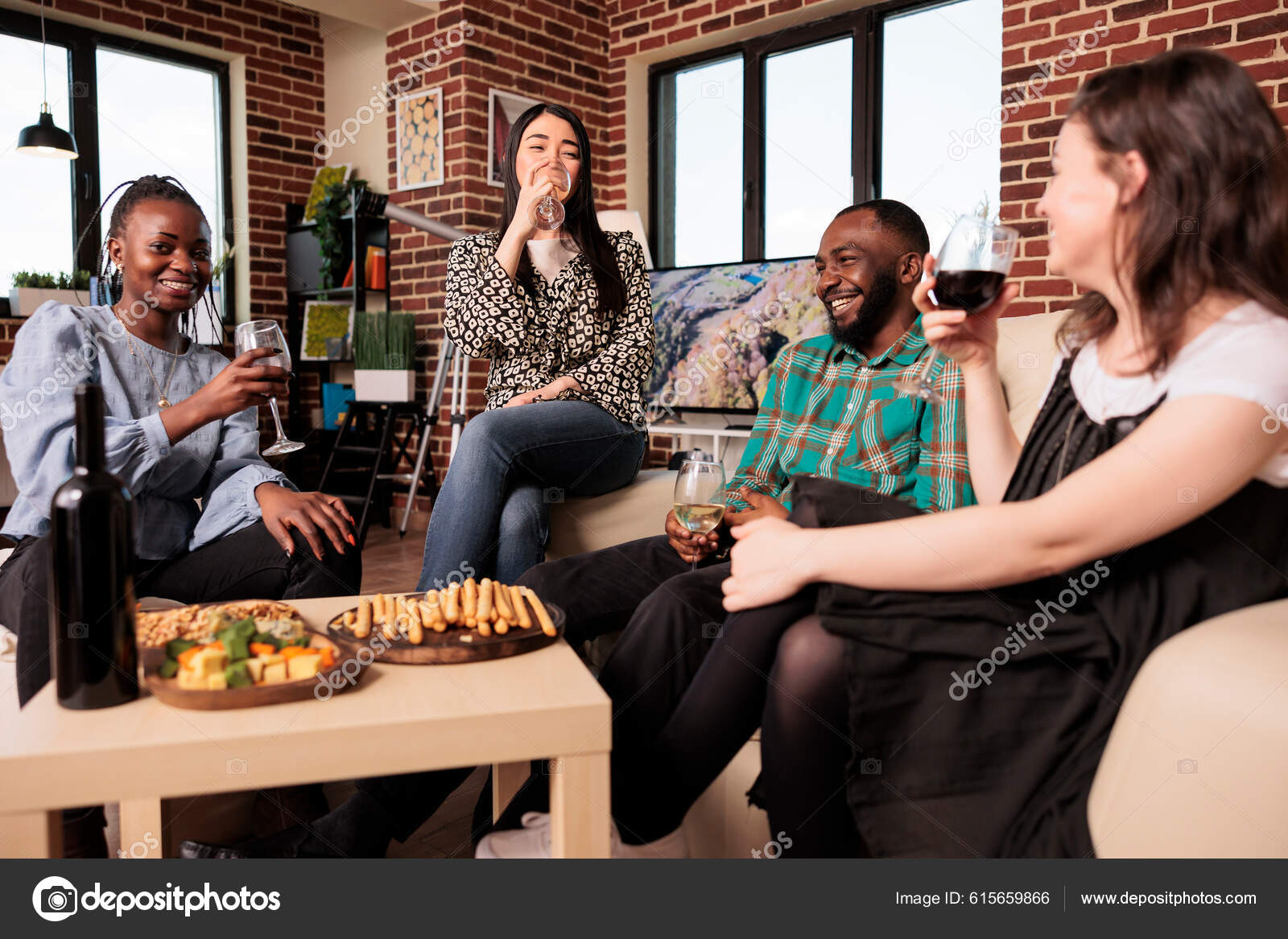 A diverse group of people sitting around a table, laughing and enjoying a meal together