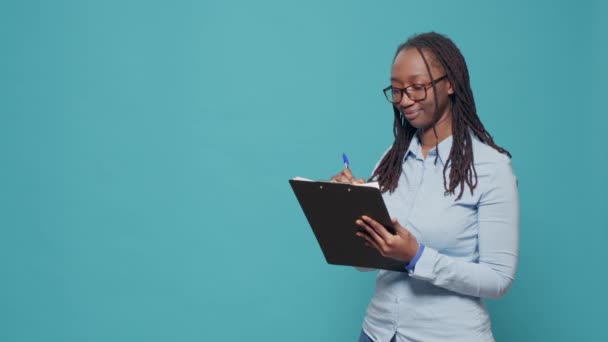 Portrait Young Adult Taking Notes Textbook Files Writing Information Clipboard — Vídeos de Stock