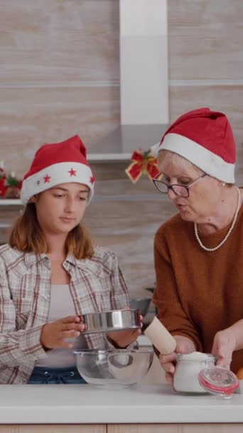 Vertical Video Grandchild Helping Senior Woman Preparing Homemade Traditional Cookie — Stock Video