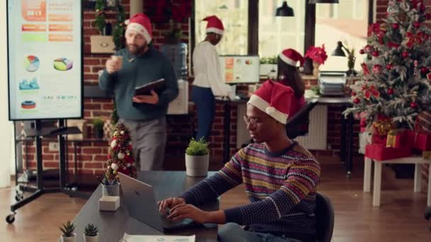 Multiethnic Team Colleagues Working Laptop Corporate Office Decorated Christmas Tree — Stock Video